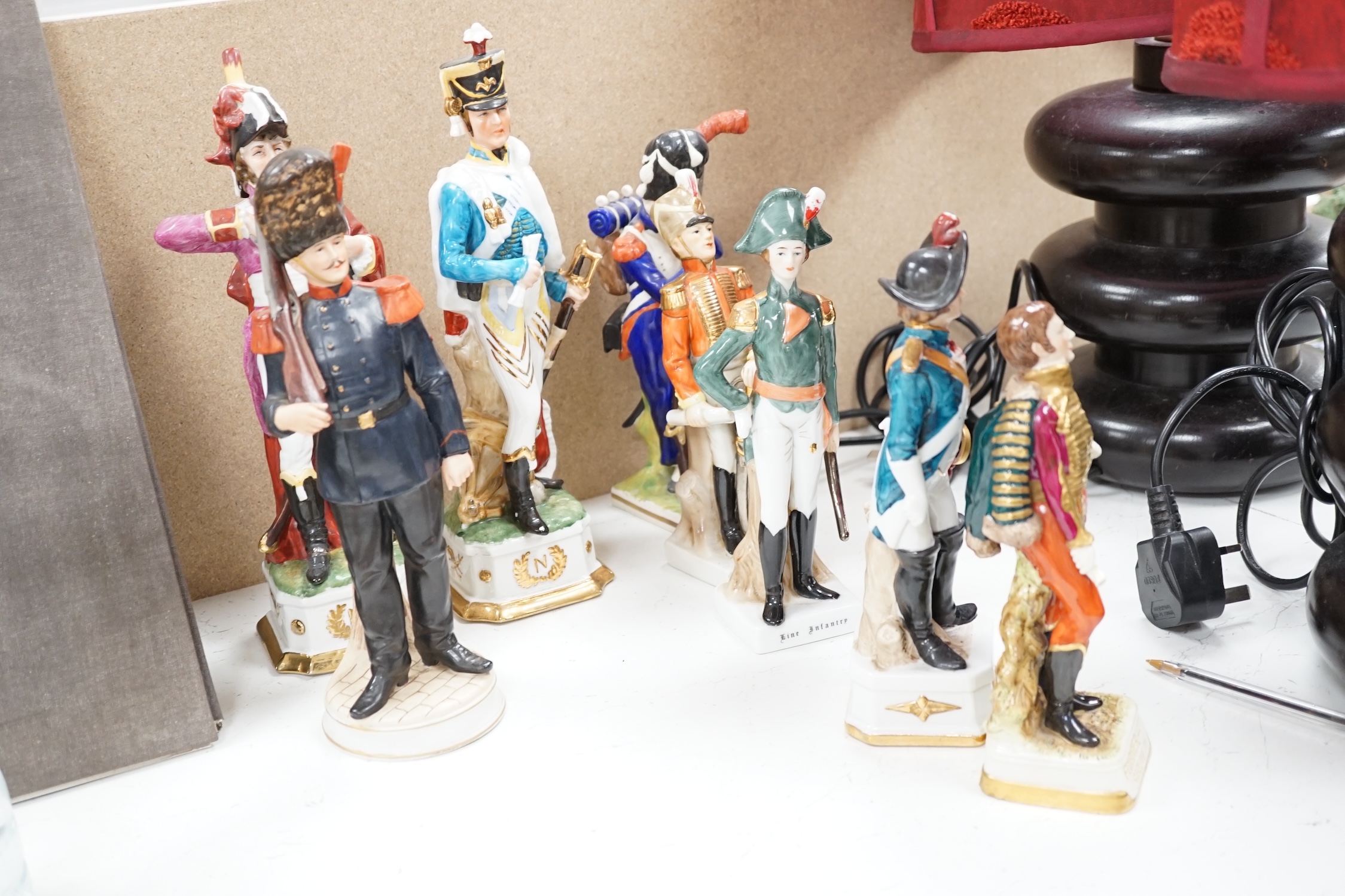 A group of thirteen naval/military figures, tallest 32cm high